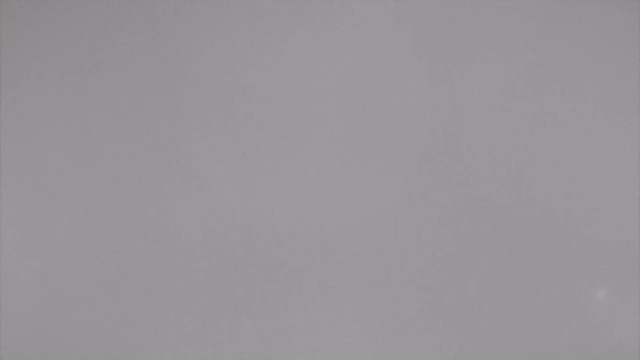 A gray, featureless surface with slight variations in shade. There are no distinct objects or details visible in the image.