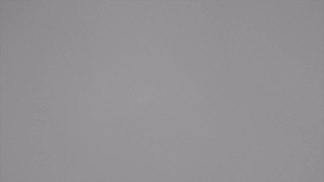 A solid gray background with a uniform texture and no visible features or objects.